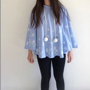 blue hooded poncho with snowflakes